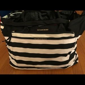 Light pink and black stripped travel bag with small carry pouch
